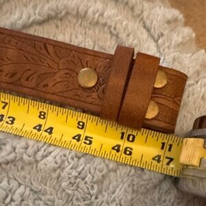 NWOT Brown Embossed Leather Belt without buckle. Never worn. Perfect condition.